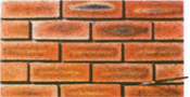 Use a small brush (about 8mm diameter and wet constantly) to smooth the mortar in the gaps between the veneers while the mortar is still wet. If you want to grout the joints, use a grouting pallet tool to carefully fill in the joints with mortar. If you prefer colored joints, oxide colorants can be mixed with the mortar. Take care not to dirty the veneer surface as cleaning is a hassle. Use a round or flat pointing tool to finish the joints when the mortar is thumbprint hard. Do not work on the joints too soon or the mortar will smear. Lastly, brush away any loose or excess dry mortar.