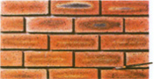 Use a small brush (about 8mm diameter and wet constantly) to smooth the mortar in the gaps between the veneers while the mortar is still wet